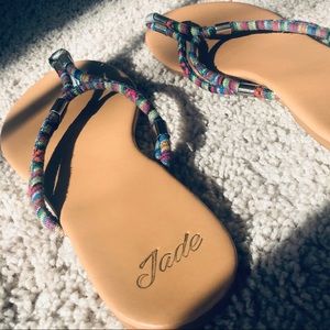 Tan color sandals.